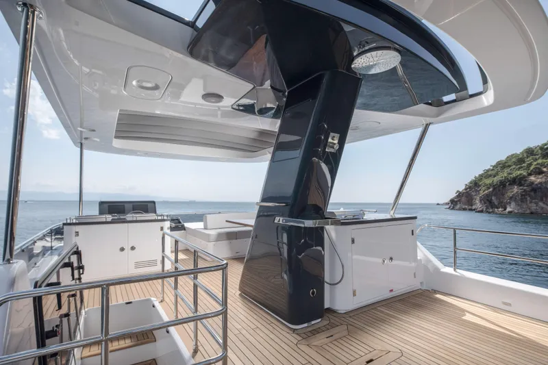 Slide: The Image of Luxurious 2026 Sirena 60 yacht deck with modern amenities and ocean view. - 22