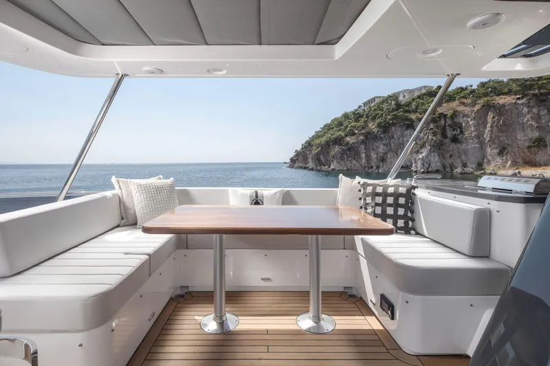 Slide: The Image of Luxurious 2026 Sirena 60 yacht interior with ocean view and elegant seating area. - 23