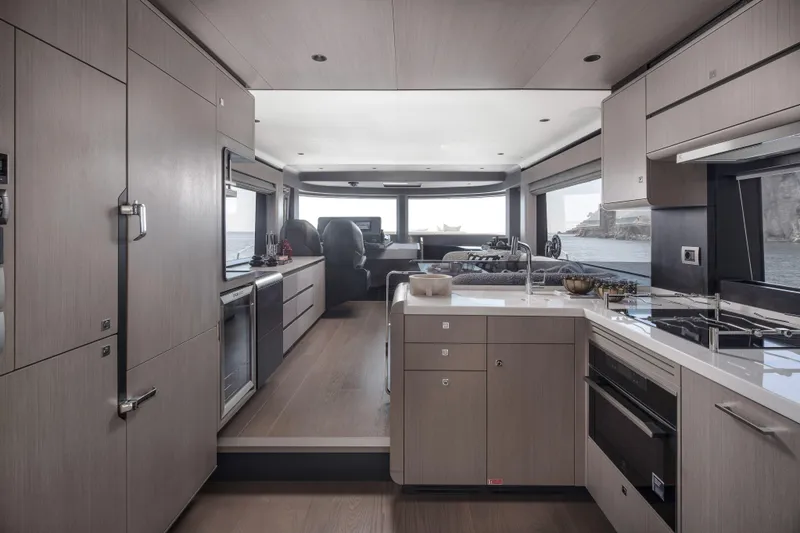 Slide: The Image of Modern interior of 2026 Sirena 60 yacht with sleek kitchen and ocean view. - 26
