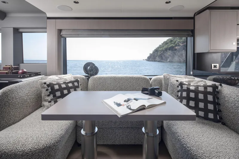 Slide: The Image of Luxurious interior of 2026 Sirena 60 yacht with ocean view through large window. - 29