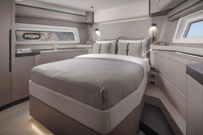 Slide: The Image of Luxurious interior of 2026 Sirena 60 yacht with elegant bedding and modern design. - 37
