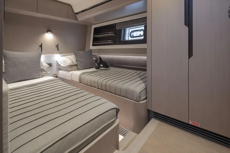 Slide: The Image of Luxurious cabin interior of 2026 Sirena 60 yacht with twin beds and modern decor. - 41