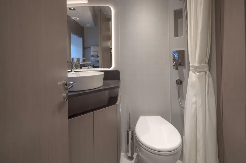 Slide: The Image of Modern bathroom interior on Sirena 60 yacht, featuring sleek fixtures and elegant design, 2026 model. - 42