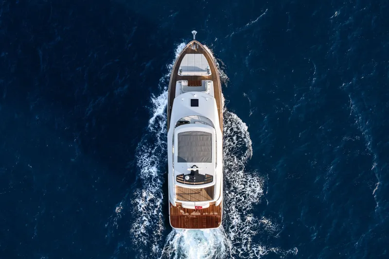 Slide: The Image of Aerial view of 2026 Sirena 60 yacht cruising through deep blue ocean waters. - 7