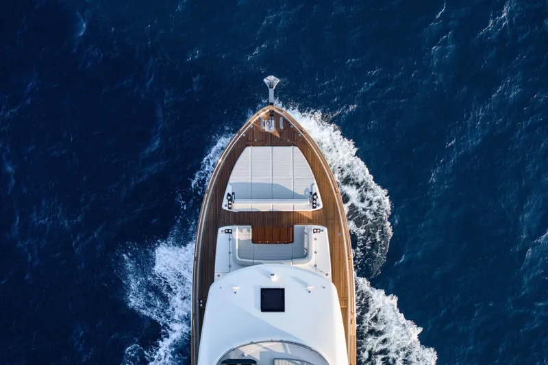 Slide: The Image of Aerial view of 2026 Sirena 60 yacht cruising through deep blue ocean waters. - 8