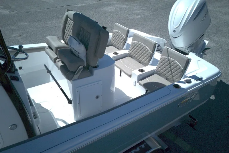 Slide: The Image of 2026 Sea Hunt BX 25 FS boat interior with cushioned seating and Yamaha outboard motor. - 14