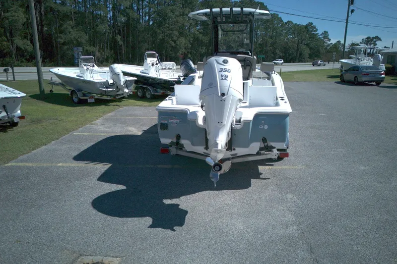 Slide: The Image of 2026 Sea Hunt BX 25 FS boat with powerful outboard motor in a dealership lot. - 3