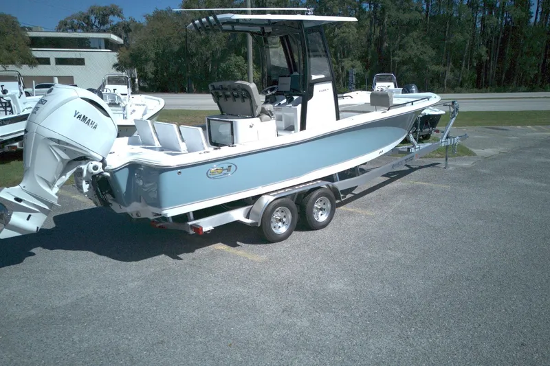 Slide: The Image of 2026 Sea Hunt BX 25 FS boat on trailer with Yamaha outboard motor. - 4