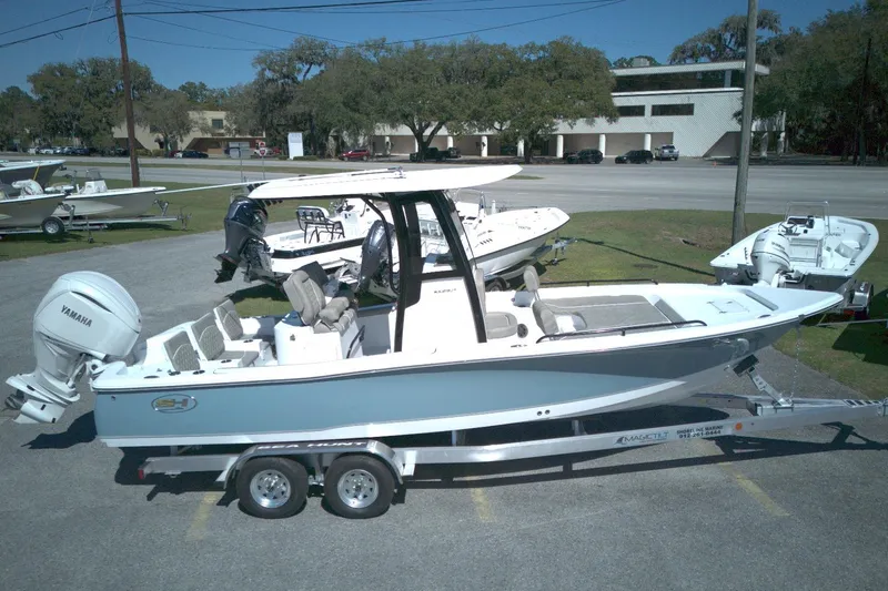 Slide: The Image of 2026 Sea Hunt BX 25 FS boat on trailer, parked outdoors, side view. - 5
