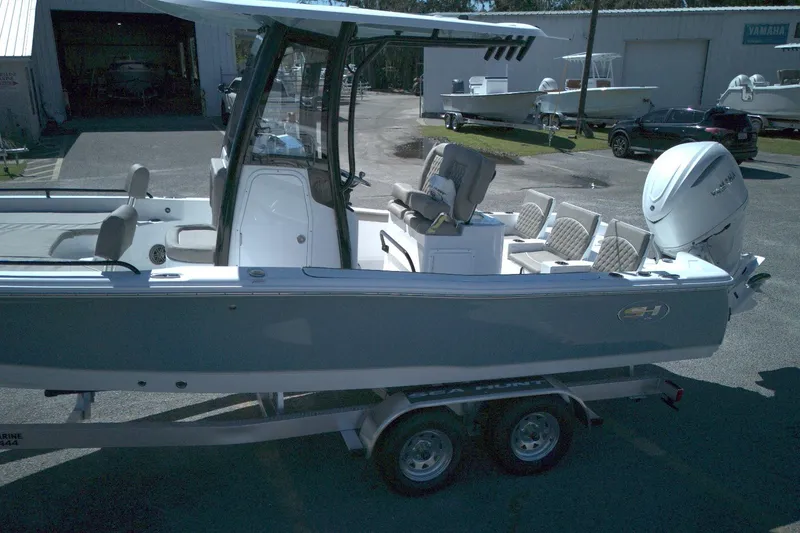 Slide: The Image of 2026 Sea Hunt BX 25 FS boat on trailer, parked outdoors. - 7