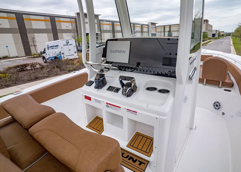 Slide: The Image of Interior of 2026 Sea Hunt Ultra 265 SE with Garmin controls. - 15