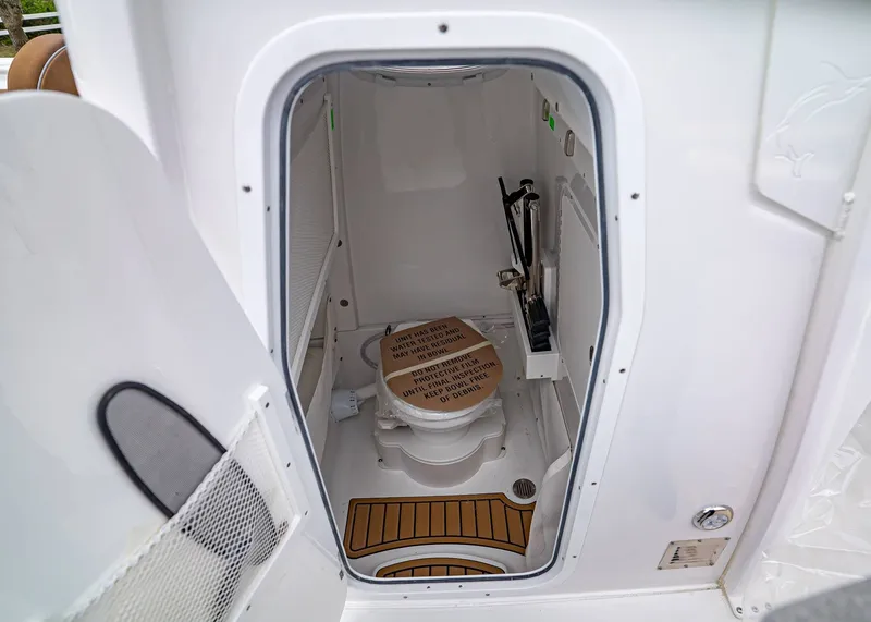 Slide: The Image of Interior of Sea Hunt Ultra 265 SE 2026 with toilet. - 18