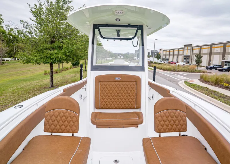 Slide: The Image of Interior of 2026 Sea Hunt Ultra 265 SE with brown seating. - 20