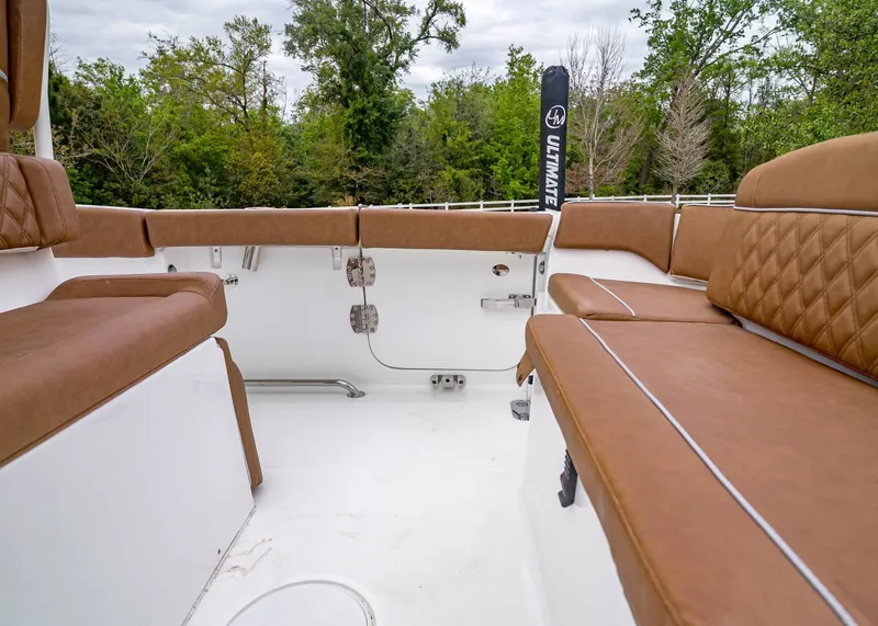 Slide: The Image of Interior of Sea Hunt Ultra 265 SE 2026 with brown seating. - 7