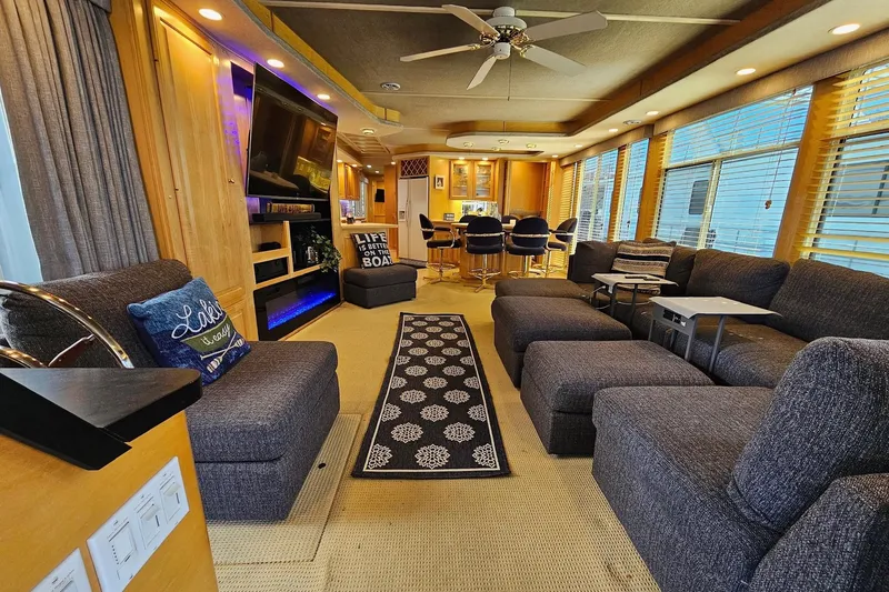 Slide: The Image of Luxurious 2001 Sumerset 16x79 houseboat interior with modern furnishings and ample seating. - 10