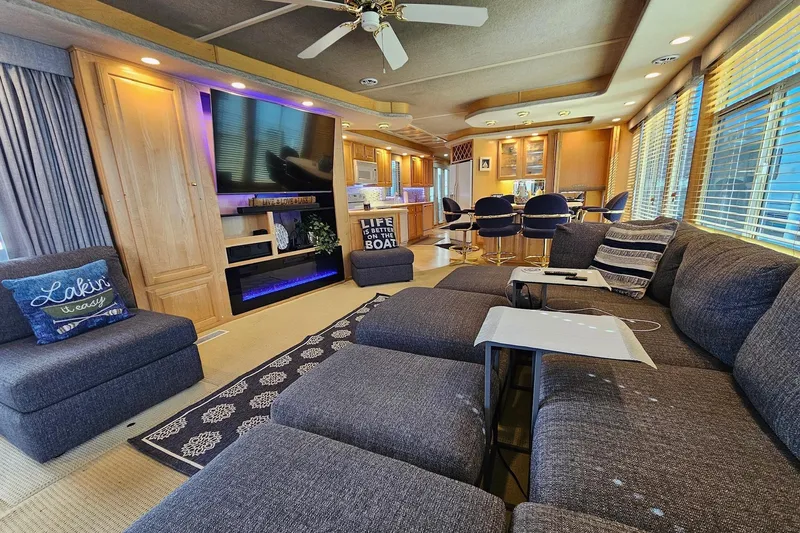 Slide: The Image of Luxurious 2001 Sumerset 16x79 houseboat interior with modern living area and kitchen. - 12