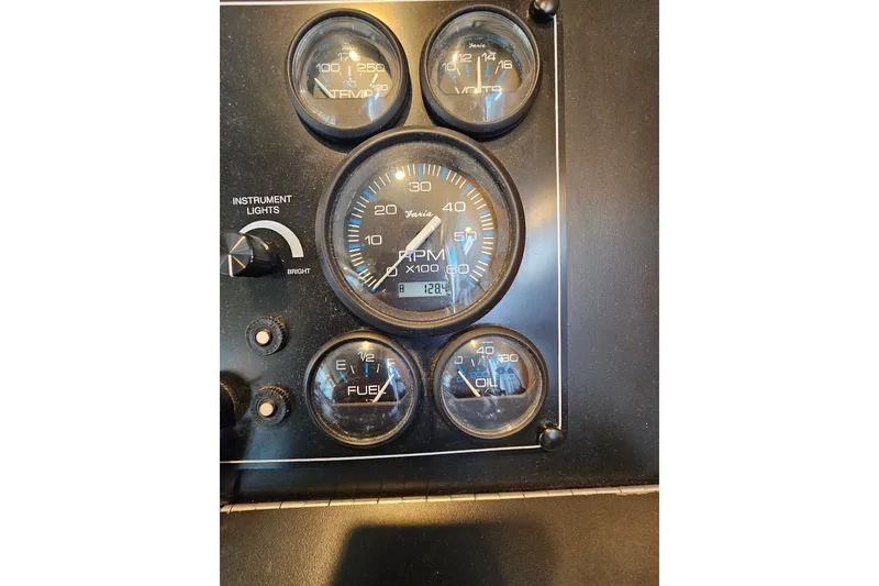 Slide: The Image of Instrument panel of a 2001 Sumerset 16x79 houseboat with gauges and controls. - 14