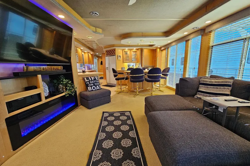 Slide: The Image of Luxurious interior of a 2001 Sumerset 16x79 houseboat with modern furnishings and decor. - 15