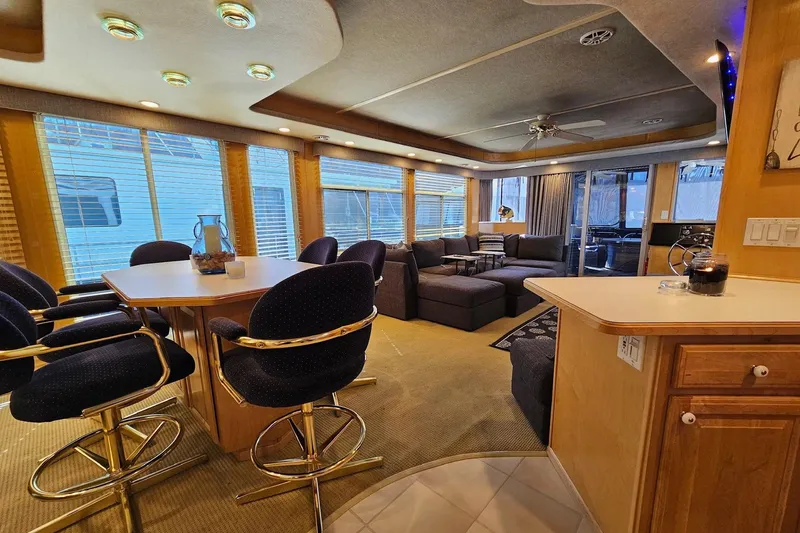 Slide: The Image of Luxurious 2001 Sumerset 16x79 houseboat interior with modern furnishings and ample seating. - 18