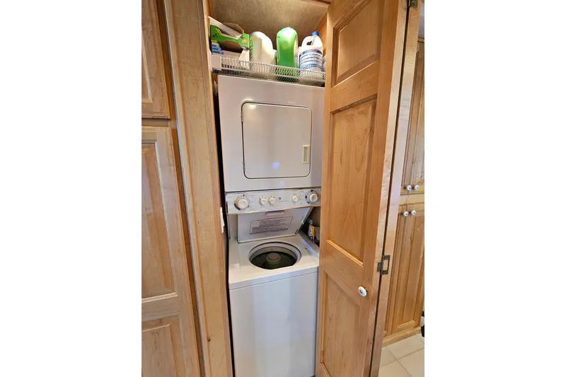 Slide: The Image of Stacked washer and dryer in wooden cabinet, Sumerset 16x79, 2001 model. - 25