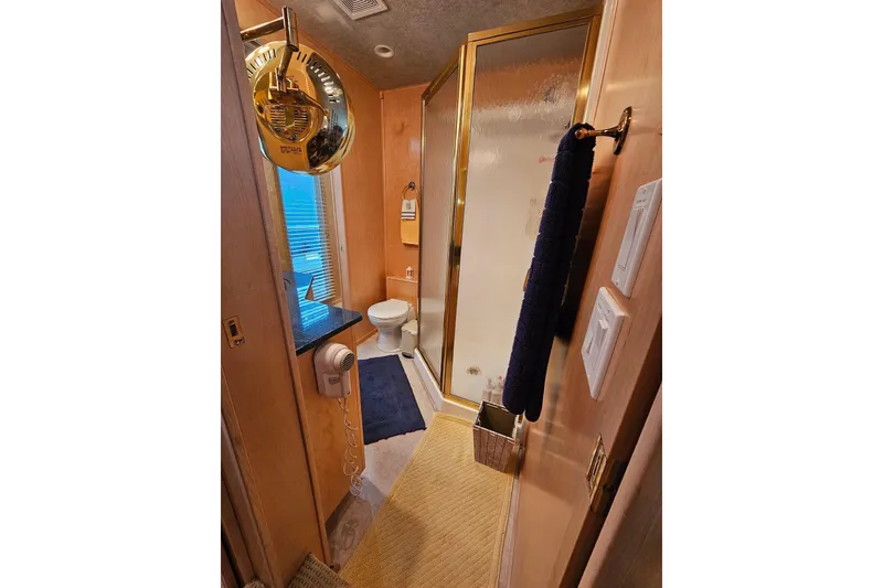 Slide: The Image of Bathroom interior of 2001 Sumerset 16x79 houseboat with shower and toilet. - 32