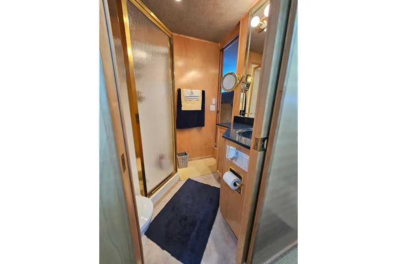 Slide: The Image of Luxurious bathroom in 2001 Sumerset 16x79 houseboat with shower and vanity. - 33