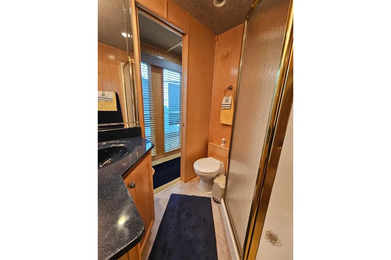 Slide: The Image of Bathroom interior of 2001 Sumerset 16x79 houseboat with shower and toilet. - 34