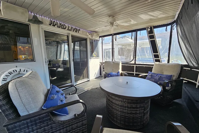 Slide: The Image of Luxurious 2001 Sumerset 16x79 houseboat interior with cozy seating and stylish decor. - 5