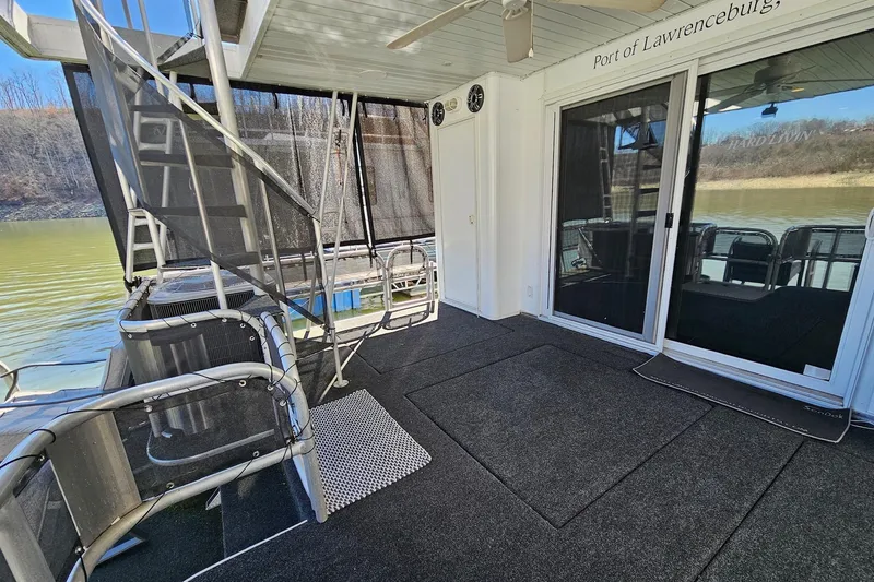 Slide: The Image of 2001 Sumerset 16x79 houseboat deck with stairs and sliding glass doors. - 53