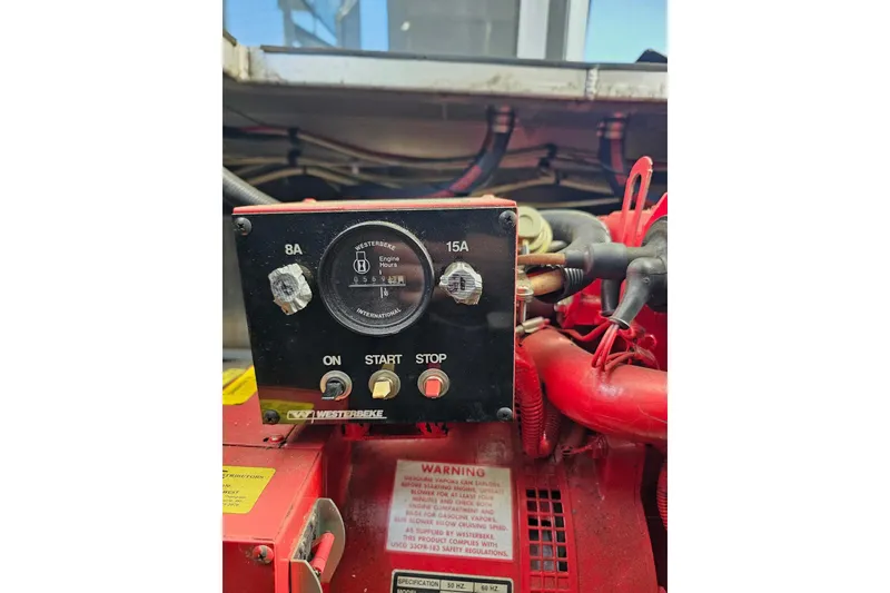 Slide: The Image of Control panel of a 2001 Sumerset 16x79 houseboat engine, featuring Westerbeke engine hour meter. - 56