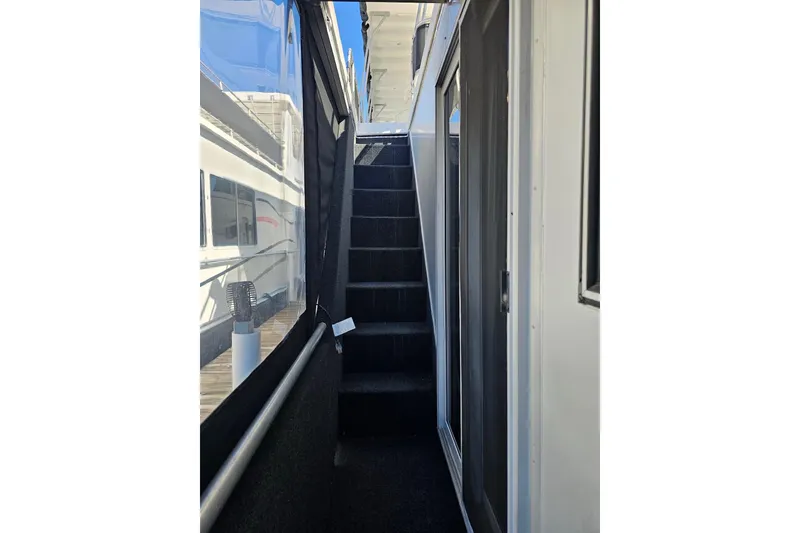 Slide: The Image of Stairway on 2001 Sumerset 16x79 houseboat with glass doors and railing. - 58