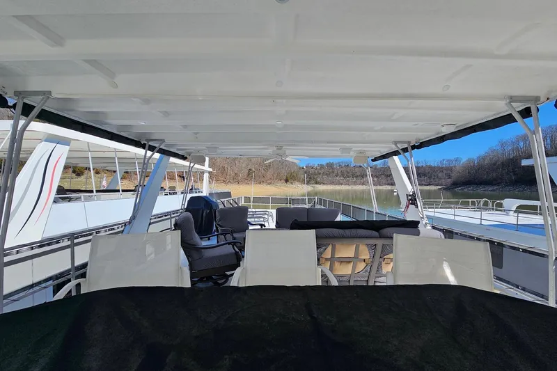 Slide: The Image of Upper deck of a 2001 Sumerset 16x79 houseboat with seating and canopy. - 68