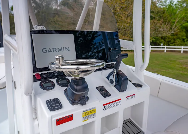 Slide: The Image of Sea Hunt Ultra 229 boat console, 2026 model, featuring Garmin navigation system. - 15