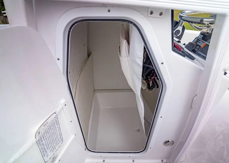 Slide: The Image of Interior of Sea Hunt Ultra 229 boat cabin, model year 2026. - 18