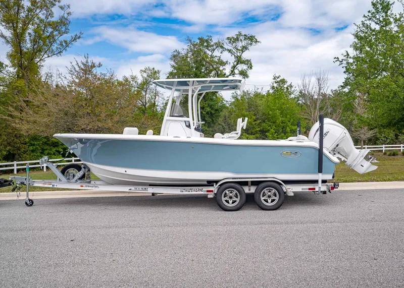 Slide: The Image of 2026 Sea Hunt Ultra 229 boat on trailer, side view. - 2