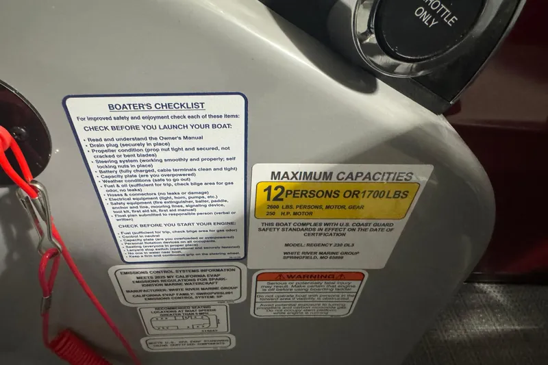Slide: The Image of Boater's checklist and capacity label on 2025 Regency 230 DL3 boat dashboard. - 12