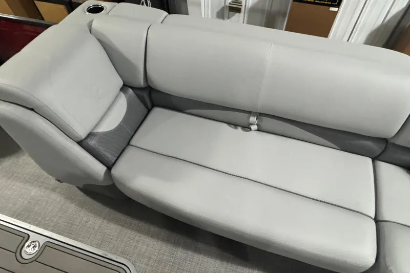 Slide: The Image of Luxurious seating on 2025 Regency 230 DL3 boat, featuring sleek gray upholstery. - 3