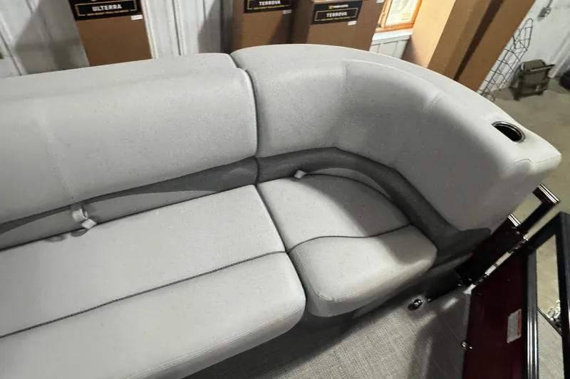 Slide: The Image of Luxurious seating on 2025 Regency 230 DL3 pontoon boat with cup holder. - 4