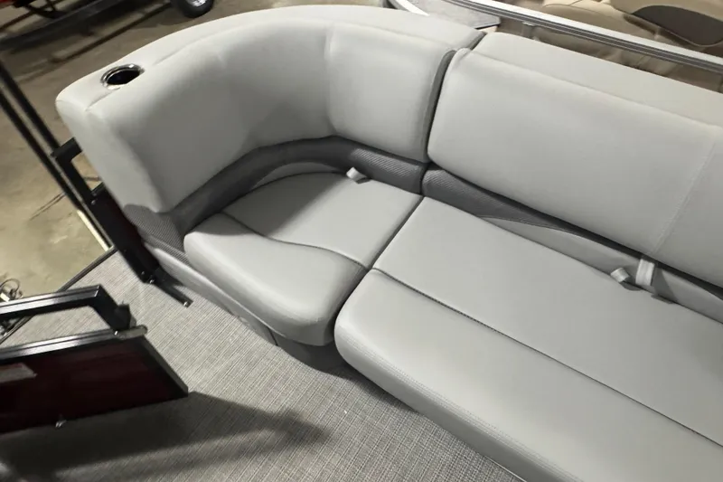 Slide: The Image of Luxurious seating on 2025 Regency 230 DL3 pontoon boat with gray upholstery. - 5