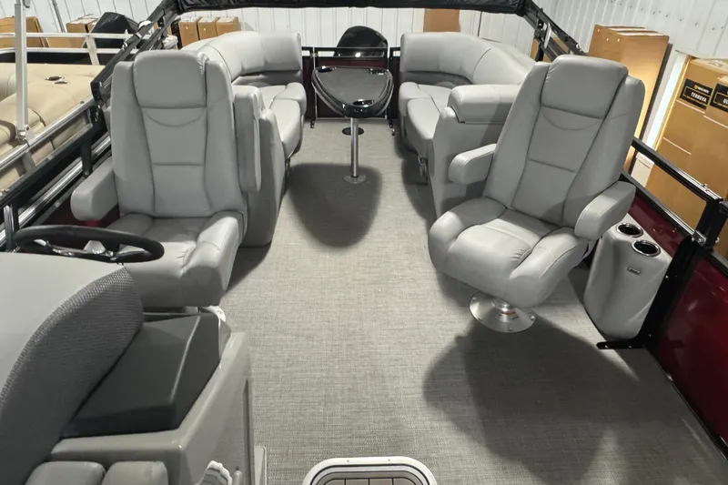 Slide: The Image of Luxurious interior of 2025 Regency 230 DL3 pontoon boat with plush seating. - 7