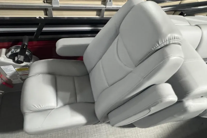 Slide: The Image of Luxurious seating in the 2025 Regency 230 DL3 boat, featuring plush gray upholstery. - 9