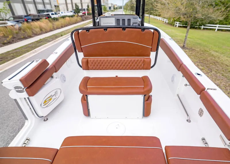 Slide: The Image of Interior of 2024 Sea Hunt Ultra 265 SE with brown leather seating. - 11