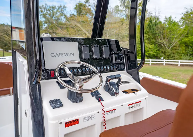 Slide: The Image of 2024 Sea Hunt Ultra 265 SE helm with Garmin navigation system. - 17