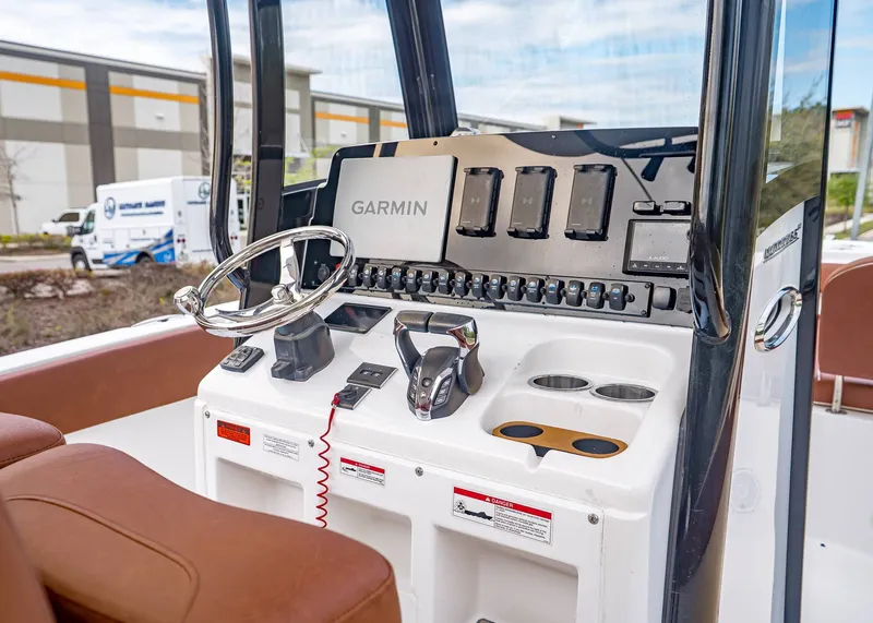 Slide: The Image of 2024 Sea Hunt Ultra 265 SE boat console with Garmin technology. - 18