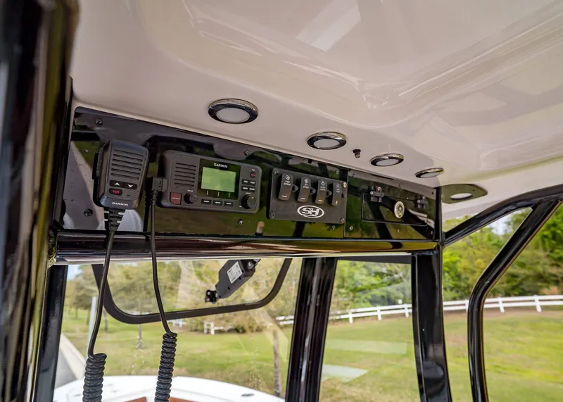 Slide: The Image of 2024 Sea Hunt Ultra 265 SE boat console with Garmin electronics. - 22