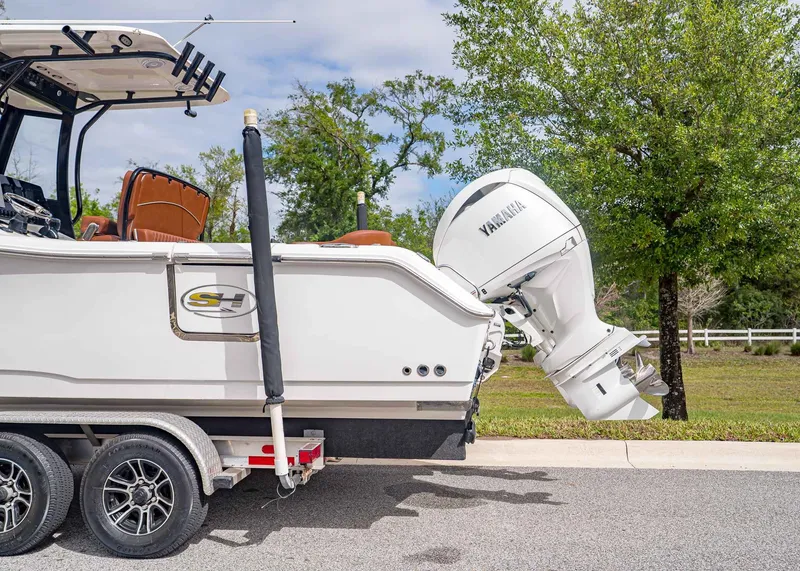 Slide: The Image of 2024 Sea Hunt Ultra 265 SE boat with Yamaha outboard motor. - 3