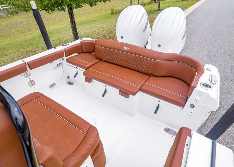 Slide: The Image of 2024 Sea Hunt Ultra 265 SE with brown leather seating. - 6