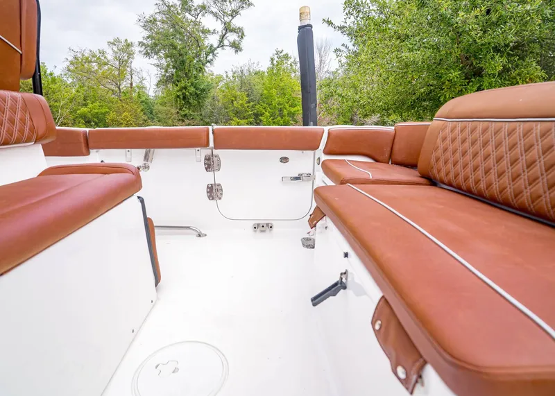 Slide: The Image of Interior of 2024 Sea Hunt Ultra 265 SE with brown seating. - 7