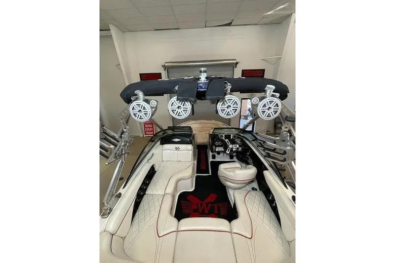 Slide: The Image of Interior of a 2010 MasterCraft XStar boat with luxury seating and audio system. - 4