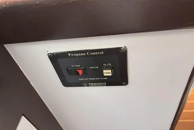 Slide: The Image of Propane control panel on a 2000 Hunter 340 boat interior. - 10